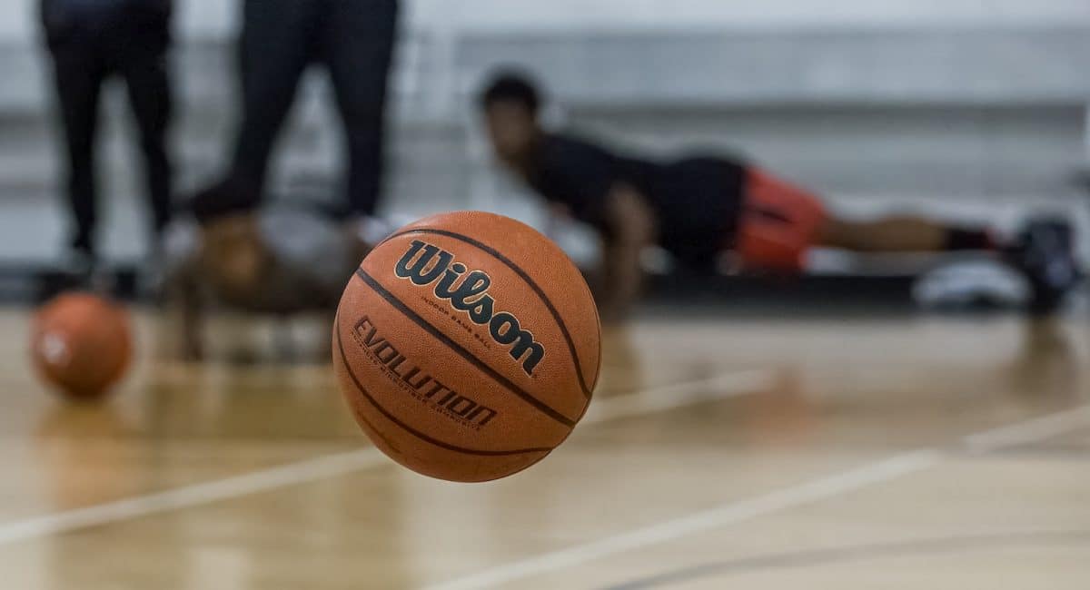 a basketball sitting on top of a basketball court