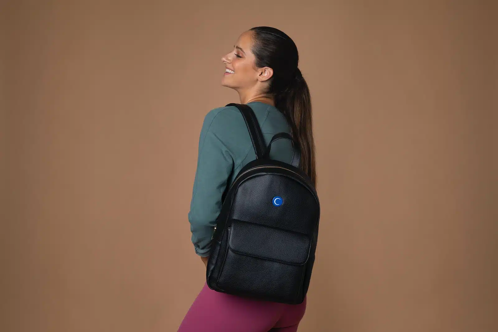 woman wearing black backpack